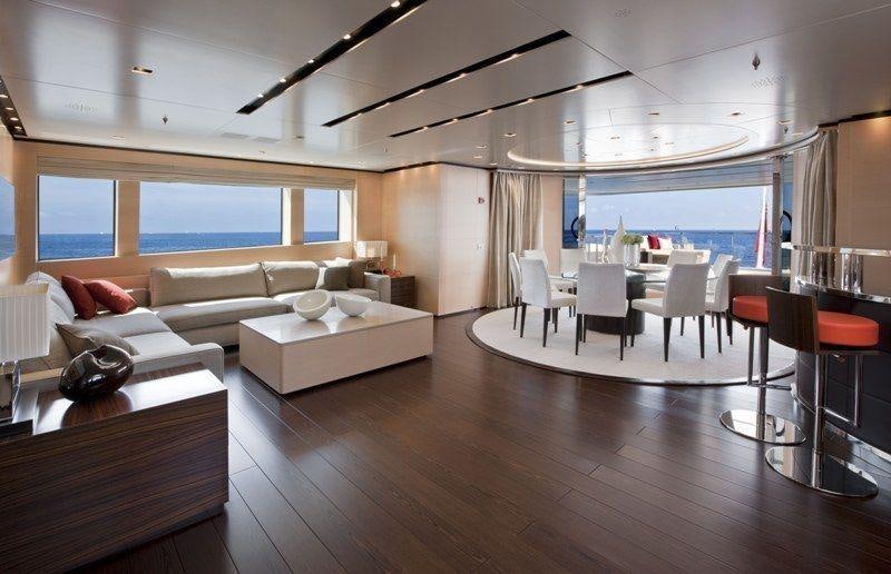 a living room with a large window aboard LAMMOUCHE Yacht for Charter