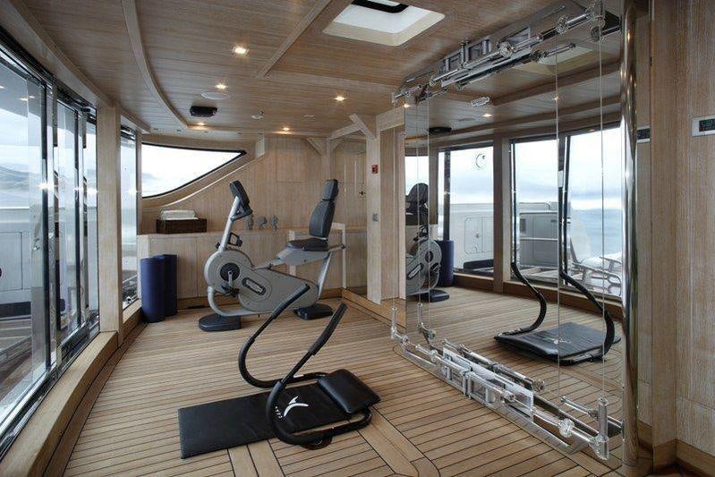 a gym with exercise equipment aboard LAMMOUCHE Yacht for Charter