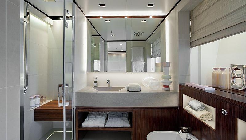 a bathroom with a large mirror aboard LAMMOUCHE Yacht for Charter