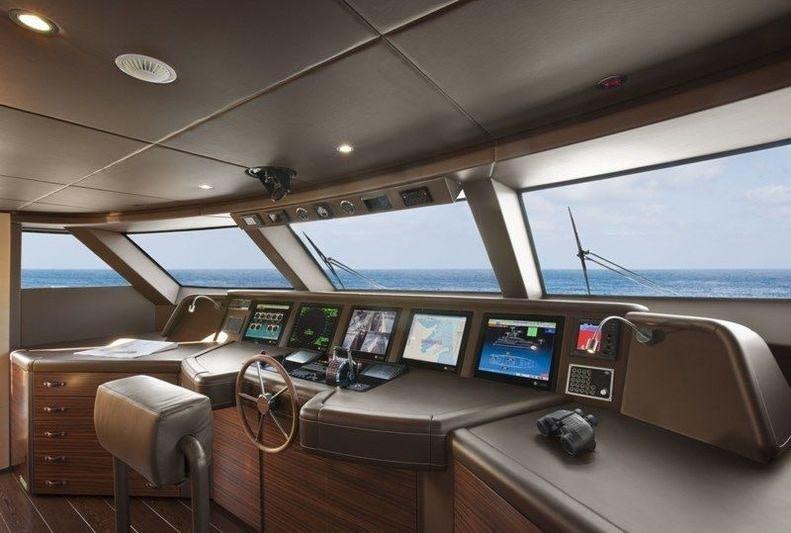 inside of a vehicle with computers and monitors aboard LAMMOUCHE Yacht for Charter