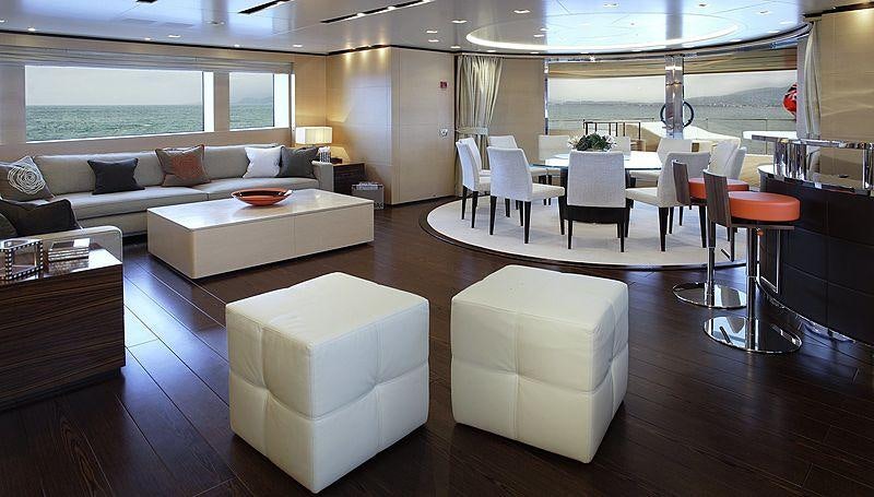 a living room with a couch and a table aboard LAMMOUCHE Yacht for Charter