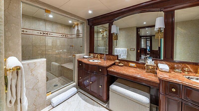 a bathroom with a large mirror aboard STARSHIP Yacht for Charter