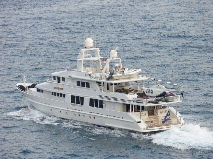 a large white boat aboard STARSHIP Yacht for Charter