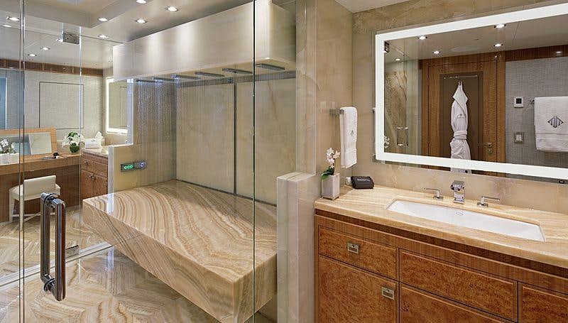 a bathroom with a large mirror aboard MUCHOS MAS Yacht for Charter