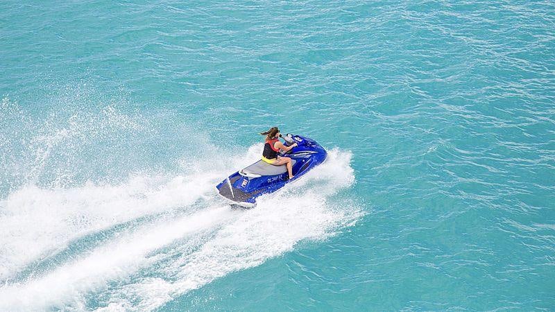 a person on a jet ski aboard CROSSED SABRE Yacht for Charter