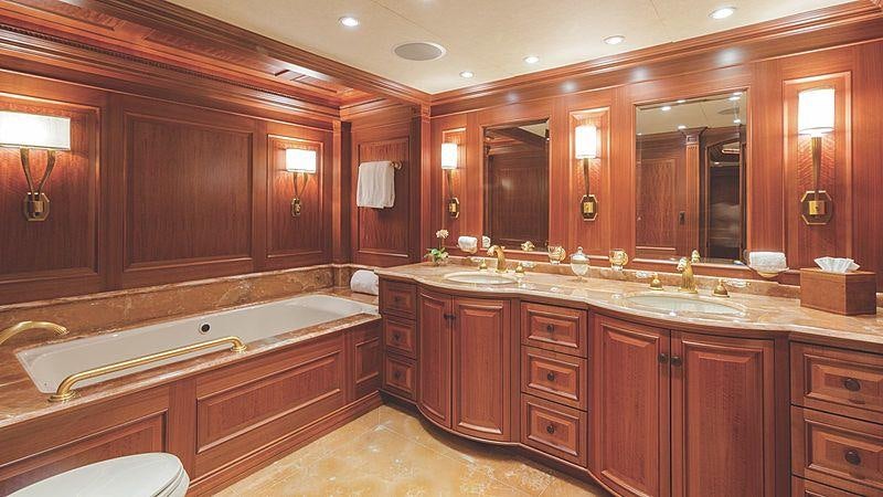 a bathroom with a large bathtub aboard CROSSED SABRE Yacht for Charter