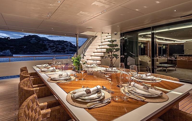 a table set for a dinner aboard SUNRISE Yacht for Charter