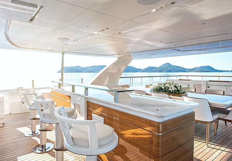 a room with a table and chairs aboard SUNRISE Yacht for Charter