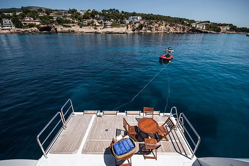a boat with chairs on the deck aboard DIANE Yacht for Charter