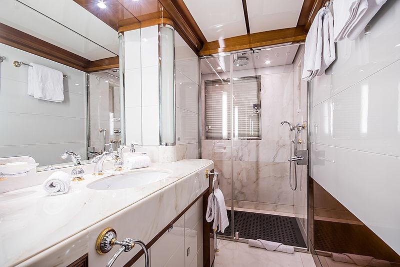 a bathroom with a sink and a mirror aboard DIANE Yacht for Charter
