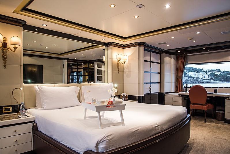a large bedroom with a large bed aboard DIANE Yacht for Charter