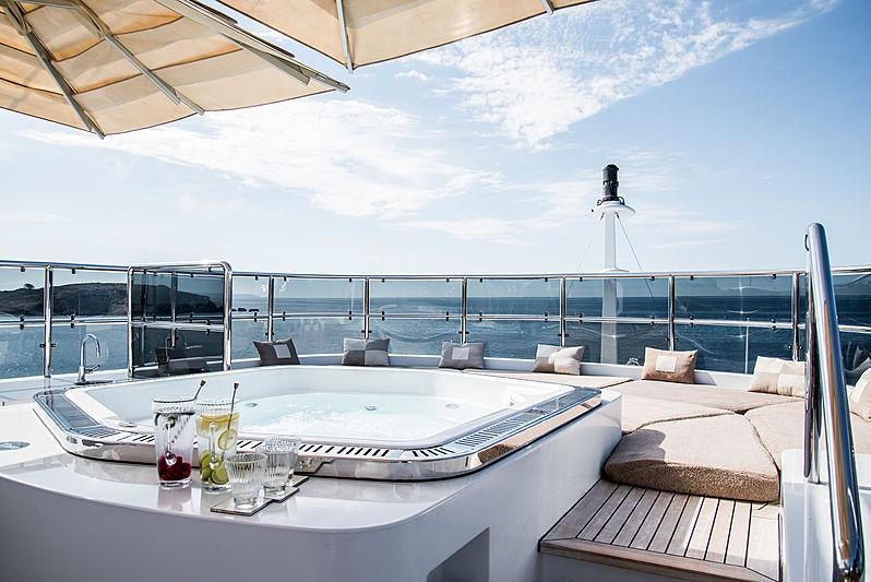 a room with a table and chairs aboard DIANE Yacht for Charter