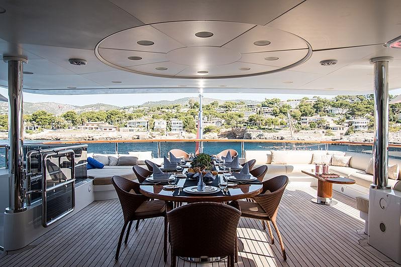 a room with a table and chairs aboard DIANE Yacht for Charter