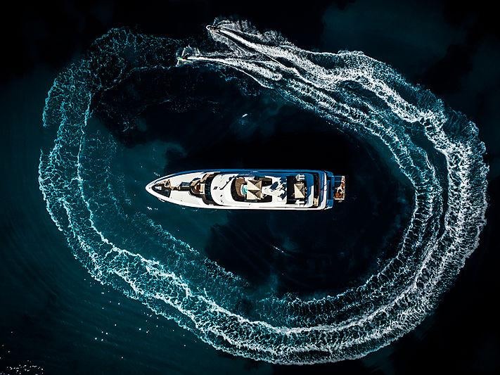 a planet with a black circle and a black circle with a white circle in the center and a aboard DIANE Yacht for Charter