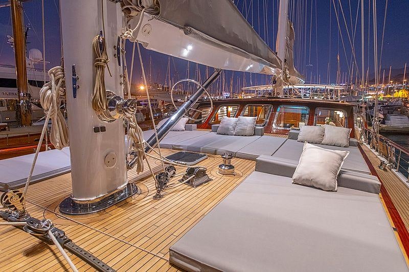 a large room with a large white bed and a large white bed aboard HIC SALTA Yacht for Charter