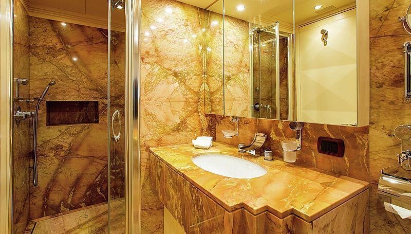 a bathroom with a large marble countertop aboard HOLIDAY Yacht for Charter
