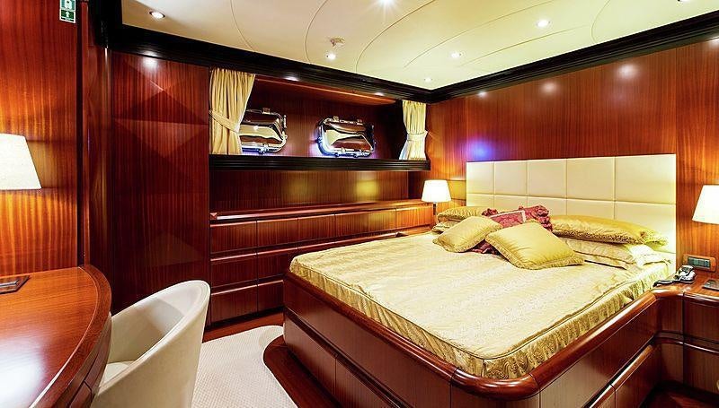 a hotel room with a bed aboard HOLIDAY Yacht for Charter