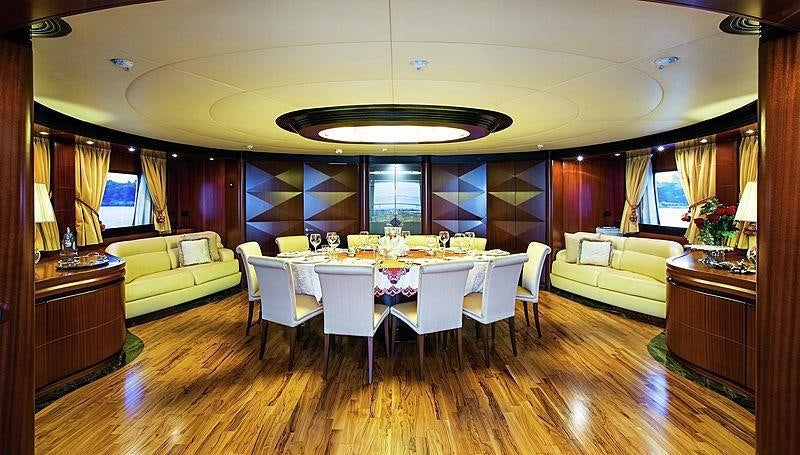 a room with a table and chairs aboard HOLIDAY Yacht for Charter