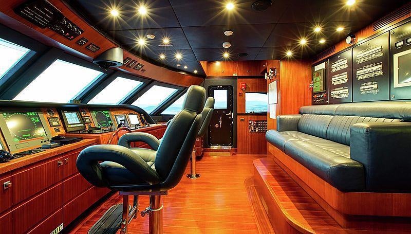 a room with a couch and a chair aboard HOLIDAY Yacht for Charter