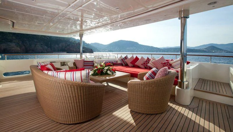 a room with a couch and chairs aboard EMOTION 2 Yacht for Charter