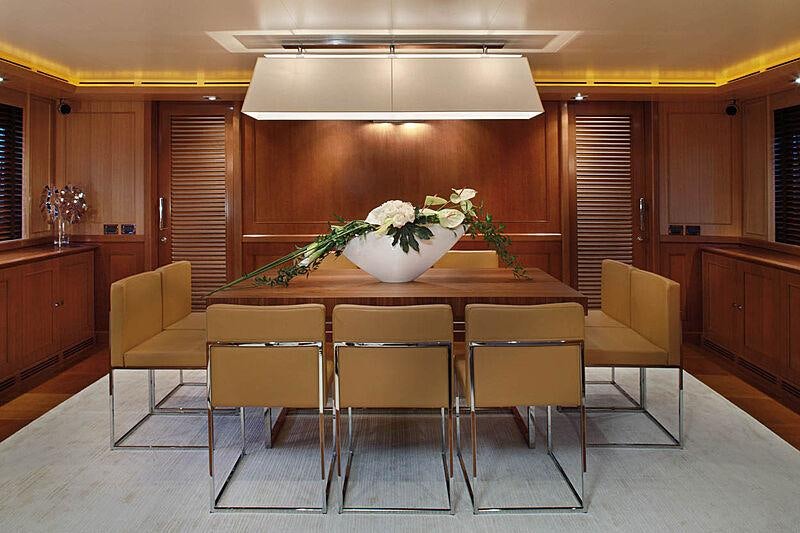 a large kitchen with a table and chairs aboard LADY I Yacht for Charter