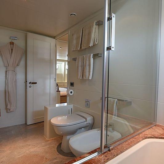 a bathroom with a glass shower aboard LIFE SAGA Yacht for Charter