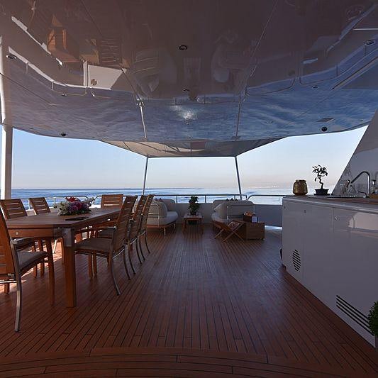 a room with a table and chairs aboard LIFE SAGA Yacht for Charter