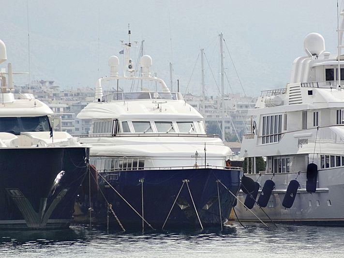 several boats in a harbor aboard JAAN Yacht for Charter