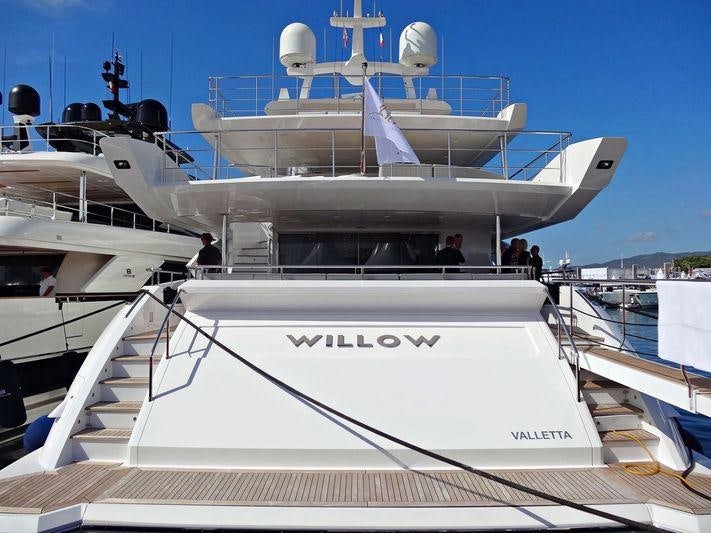 a white boat with a group of people on it aboard WILLOW Yacht for Charter