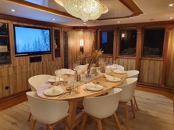 a dining table set for a dinner aboard IRAMA Yacht for Charter