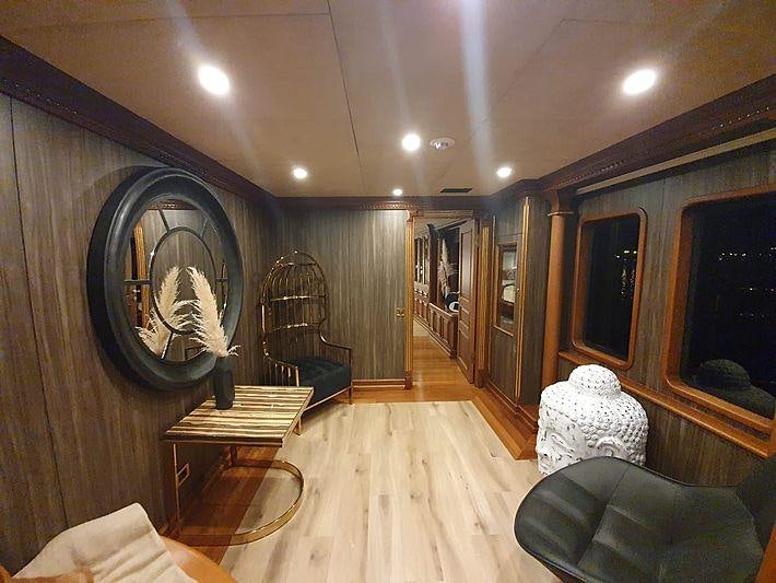 a large room with a wood floor aboard IRAMA Yacht for Charter