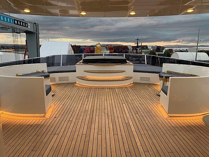 a large kitchen with a wood floor aboard IRAMA Yacht for Charter