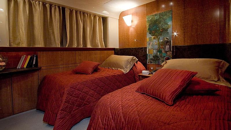 a couple of beds in a hotel room aboard CONDOR A Yacht for Charter