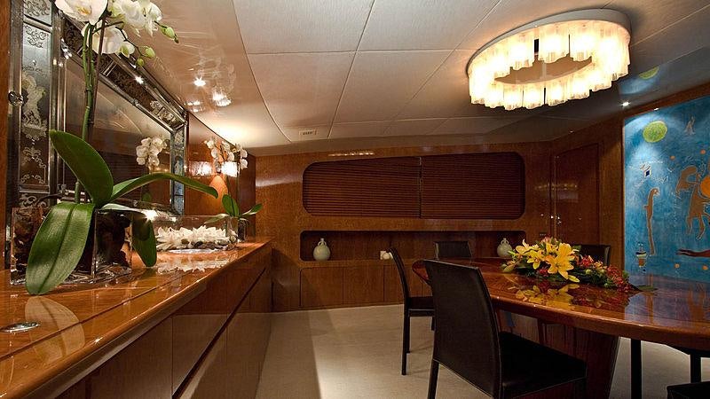a room with a table and chairs aboard CONDOR A Yacht for Charter
