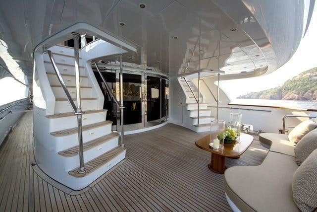 a white spiral staircase in a house aboard LADY G II Yacht for Charter