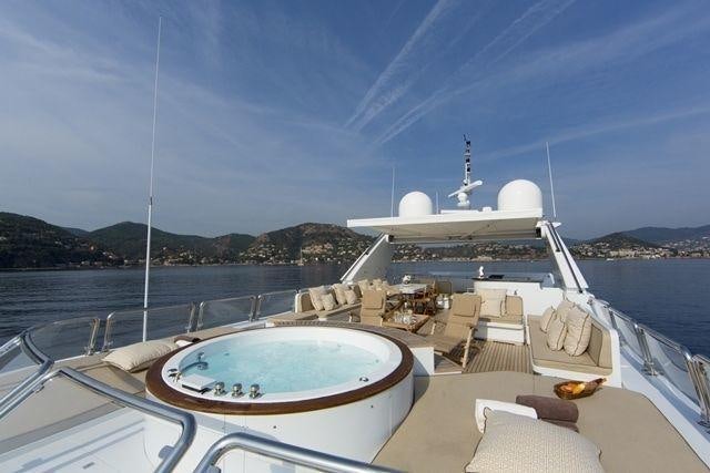 a large white boat on a body of water aboard LADY G II Yacht for Charter