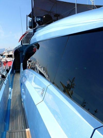 a boat with a person standing on the deck aboard WAVERUNNER Yacht for Charter