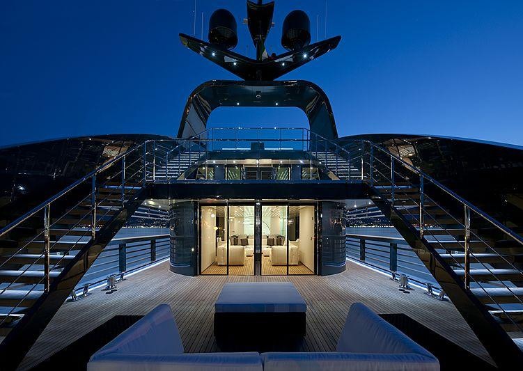 a large ship with a statue on top of it aboard OCEAN PEARL Yacht for Charter