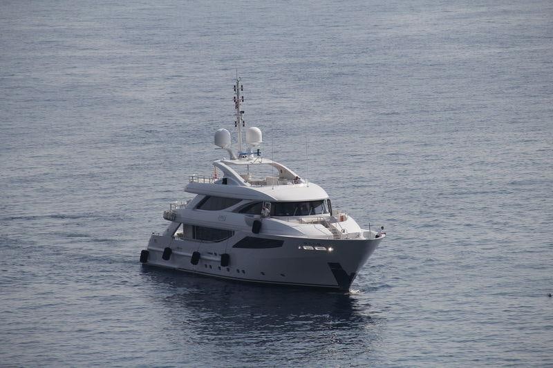 a white boat in the water aboard AZIZA Yacht for Charter