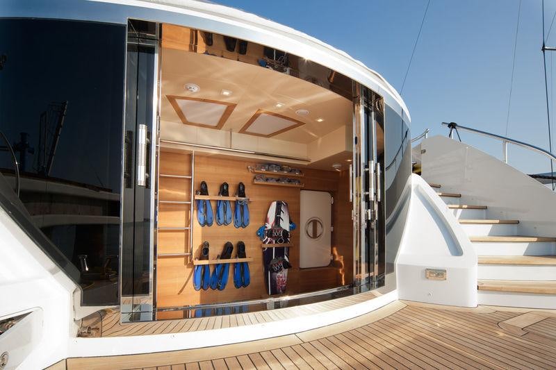 a large glass case with a door open aboard AZIZA Yacht for Charter