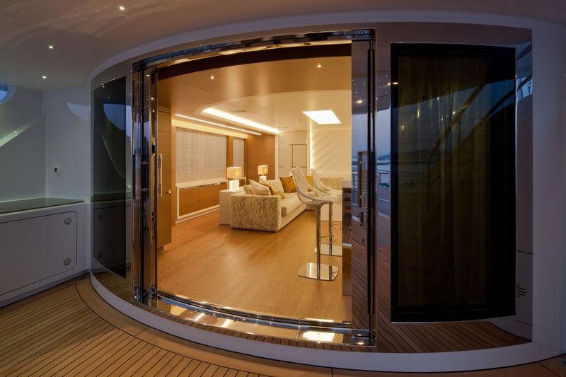 a large room with a bed and a large mirror aboard AZIZA Yacht for Charter