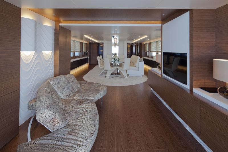 a living room with a wood floor aboard AZIZA Yacht for Charter