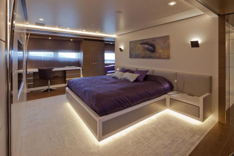 a large bed in a room aboard AZIZA Yacht for Charter