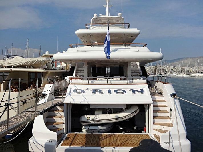 a large white boat docked aboard O'RION Yacht for Charter