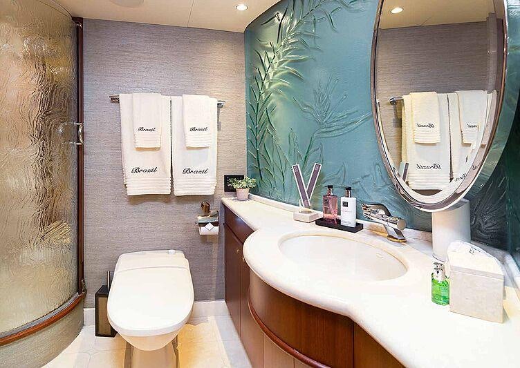 a bathroom with a large mirror aboard BRAZIL Yacht for Charter