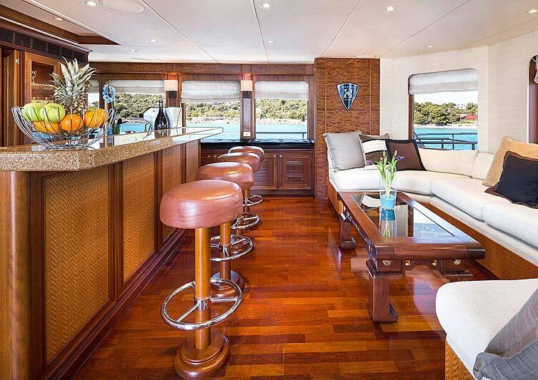 a living room with a table and chairs aboard BRAZIL Yacht for Charter