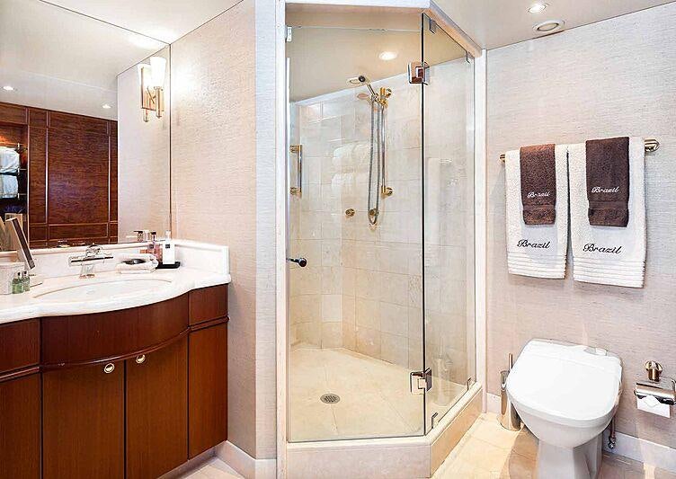 a bathroom with a glass shower aboard BRAZIL Yacht for Charter