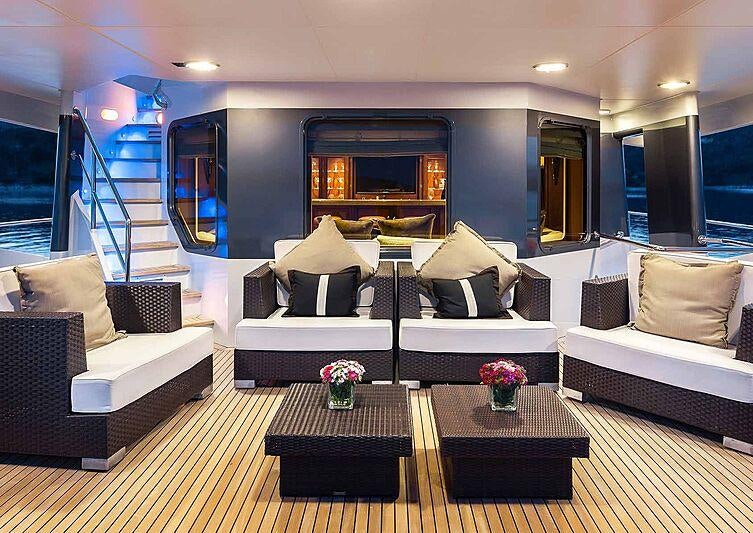 a living room with a large window aboard BRAZIL Yacht for Charter