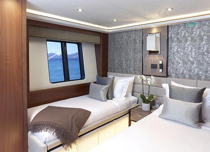 a room with two beds aboard IMPERIAL PRINCESS BEATRICE Yacht for Charter
