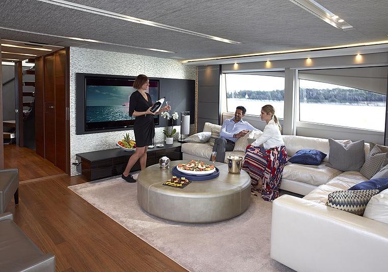 a person standing in a living room aboard IMPERIAL PRINCESS BEATRICE Yacht for Charter